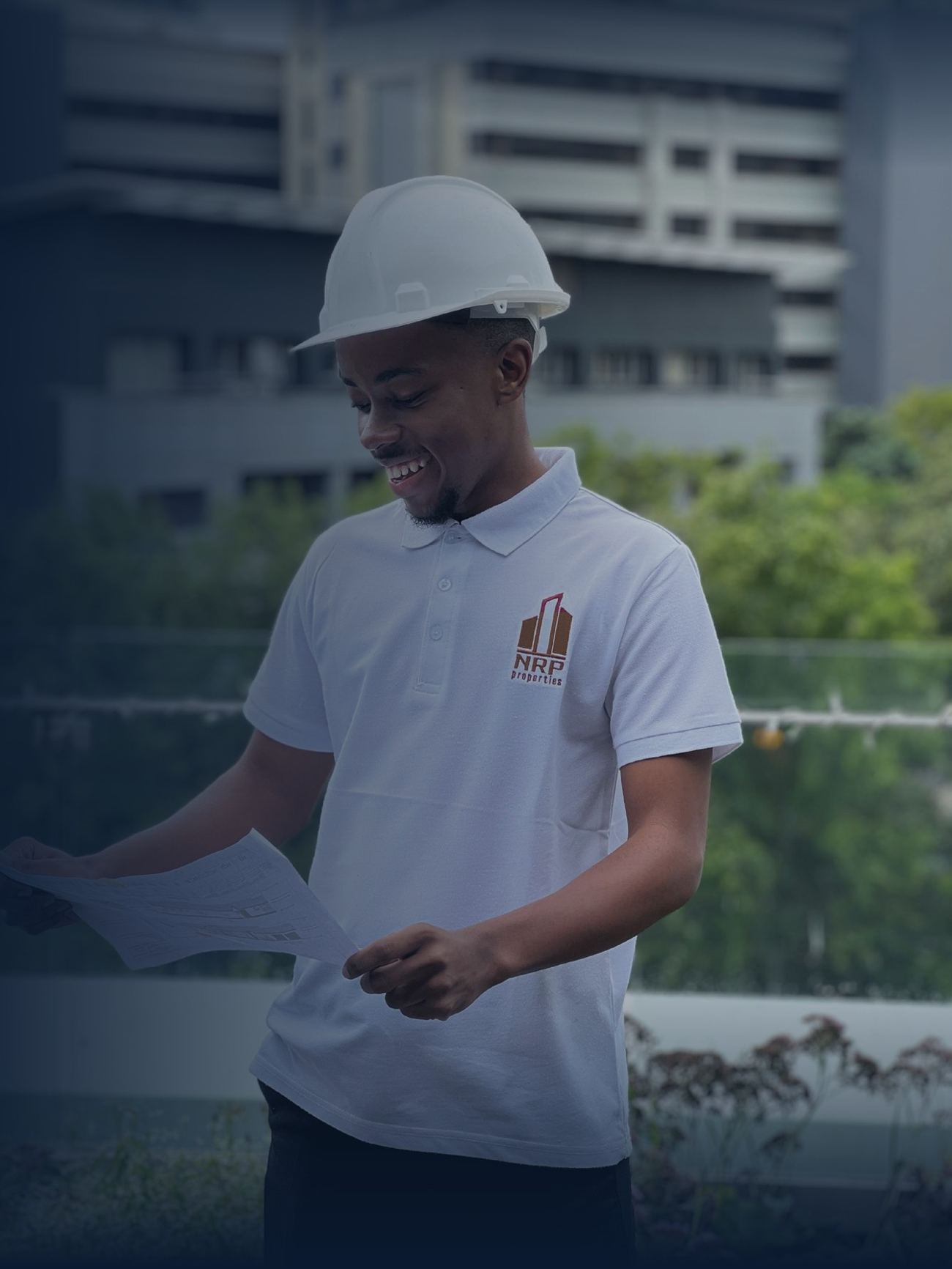 NRP site supervisor reviewing drawings on a Johannesburg project