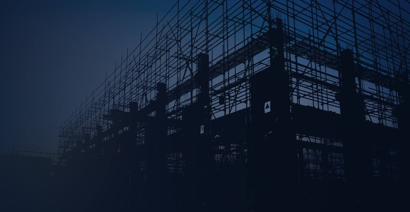 Building structure under construction at dusk